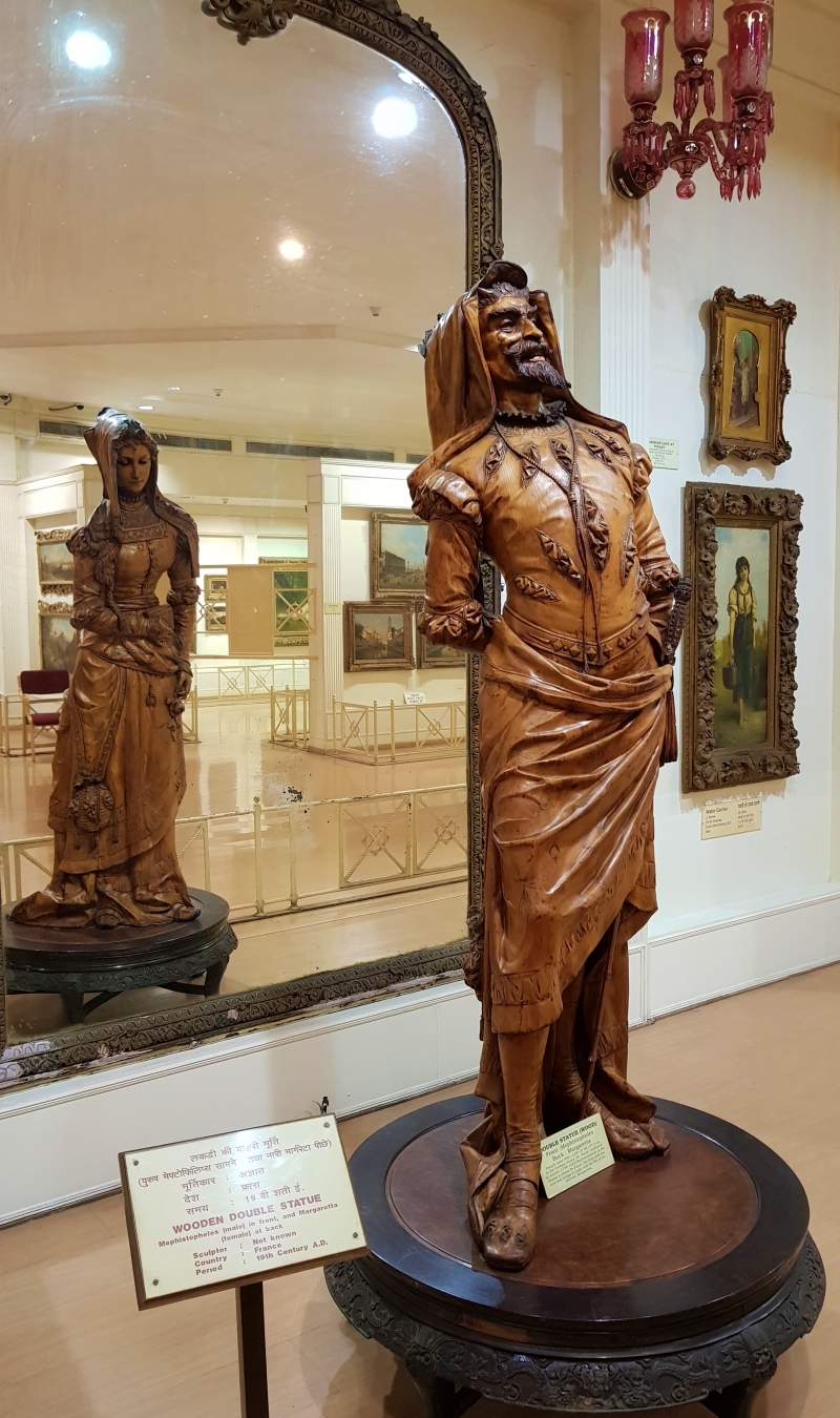 two-faced wooden sculpture at salar jung museum