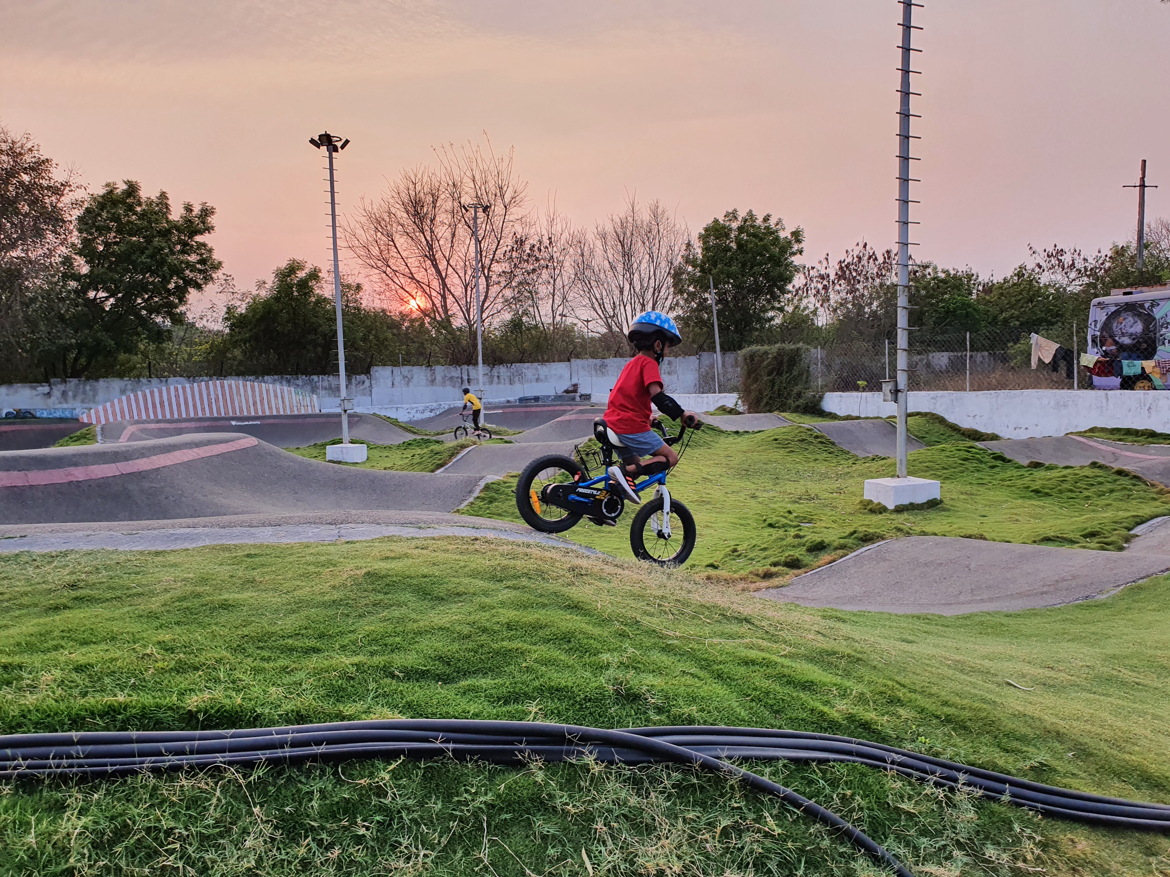 child riding a cycle on a pump track