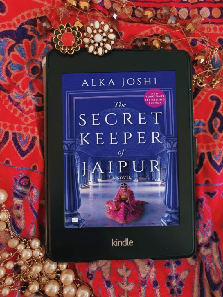 Kindle paperwhite with the cover of the secret keeper of jaipur