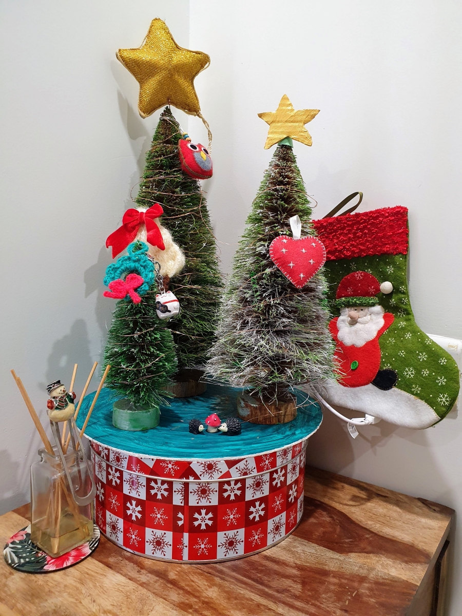 trio of Eco friendly christmas trees made with coir decorated with handmade baubles