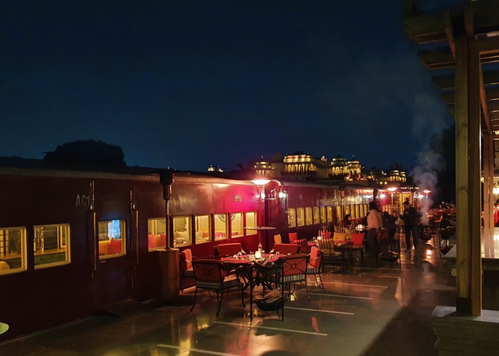 Restored steam engine converted to restaurant seating area at taj rambagh palace, Jaipur