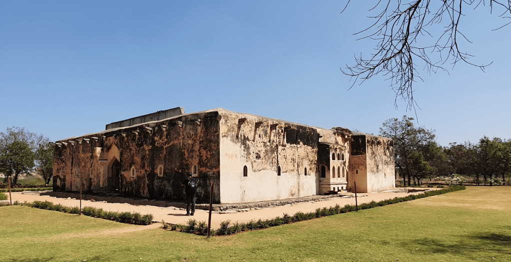 Hampi Queen's bath complex from outside set in a lawn