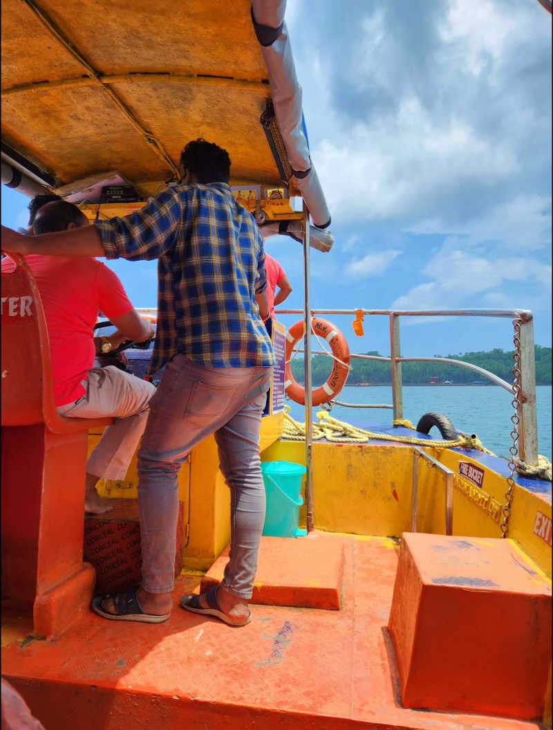 ferry driver and helper on the small boat to Ross Island from Port Blair