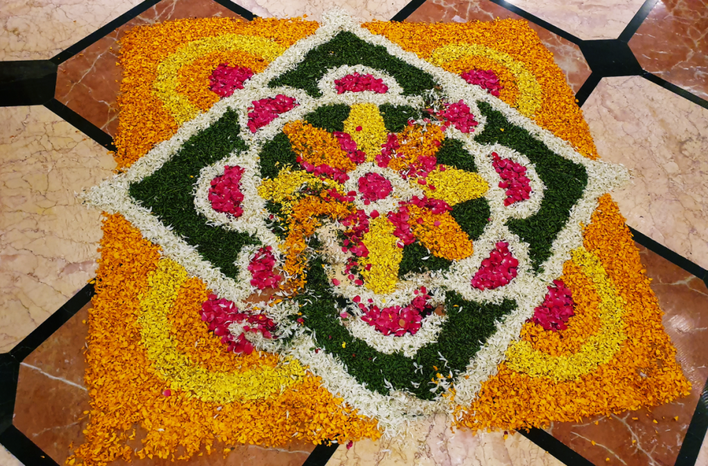 floral designed rangoli made with flower petals and leaves for diwali