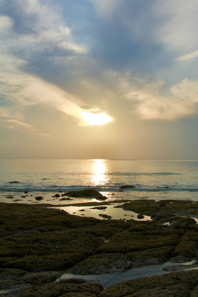 sunrise on kala patthar beach on a cloudy morning