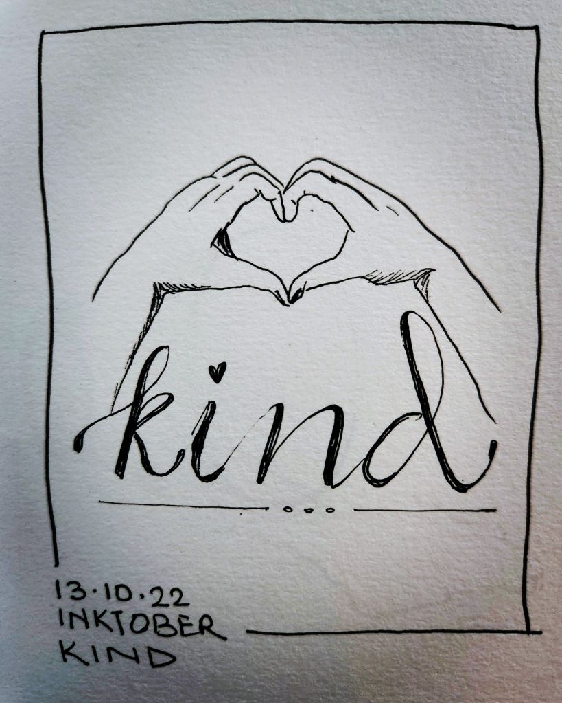 Inktober 2022 Day 13 prompt: Kind. The work Kind written in cursive with a drawing of 2 hands forming a heart shape with their fingers