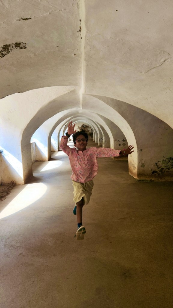 boy leaping to touch the low arches of Colonel Bailey’s Dungeon
