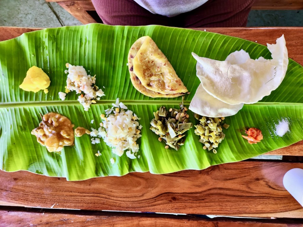 Indian thali meal served on a banana leaf
