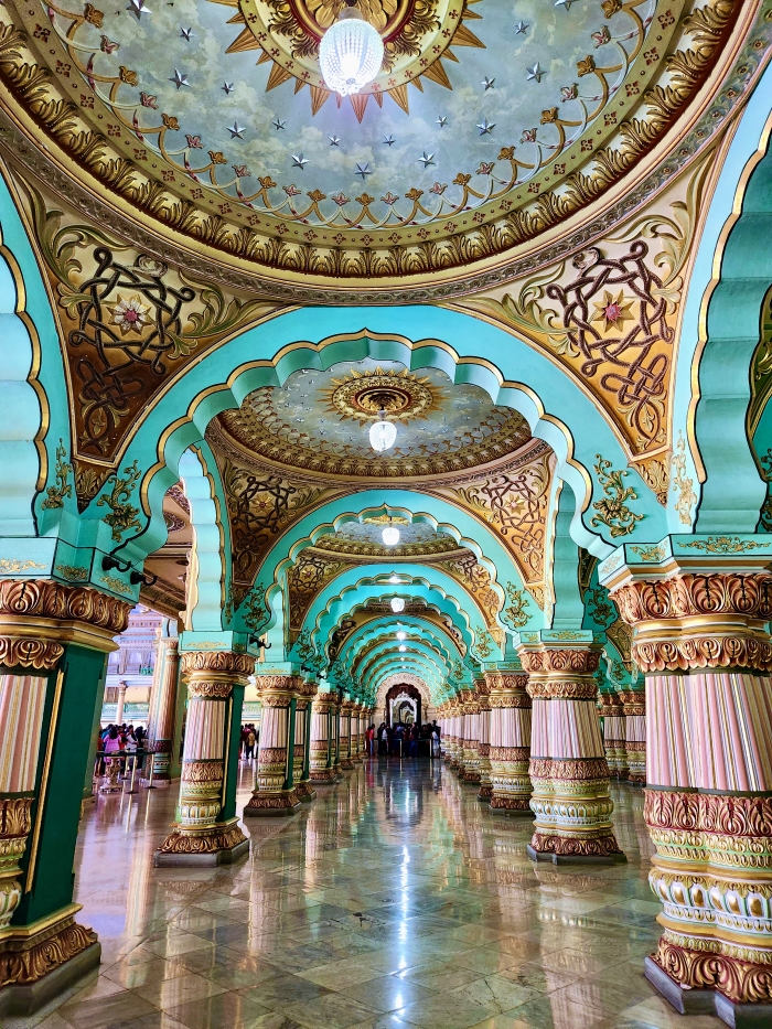 beautiful turquoise and gold pillars and arches in the mysore palace