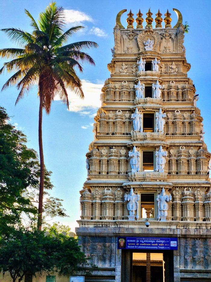 The Lakshmi Ramanaswamy temple, Amba Vilas Palace, Mysore palace
the gopuram at the entrance is intricately carved and the top of it is adorned with golden pillars. Next to it is a palm tree almost as tall as the temple tower