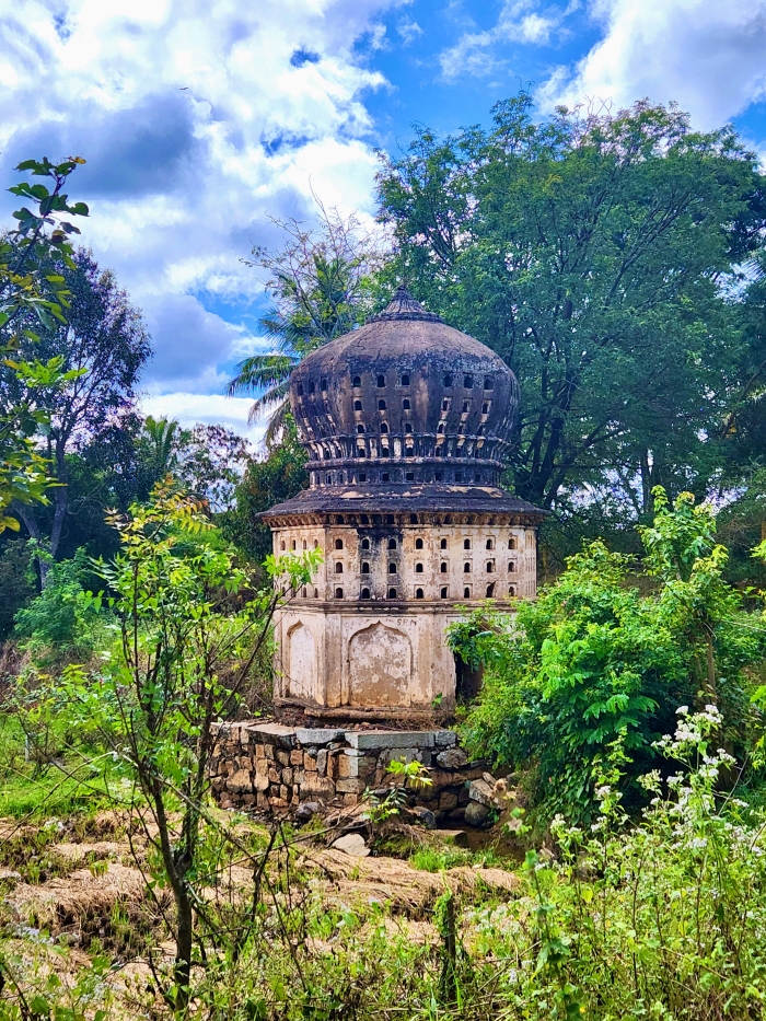 old monument with a dome among the trees at srirangapatna