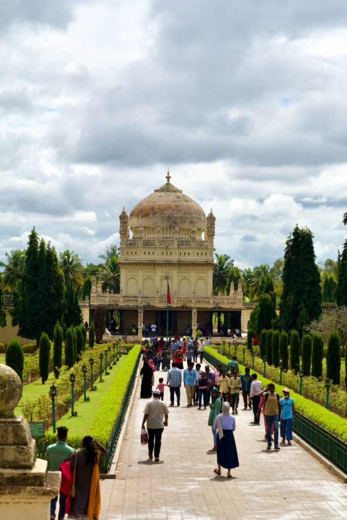 people walking on the Avenue leading to the domed structure that is the resting place of Tipu Sultan and his family in mysore