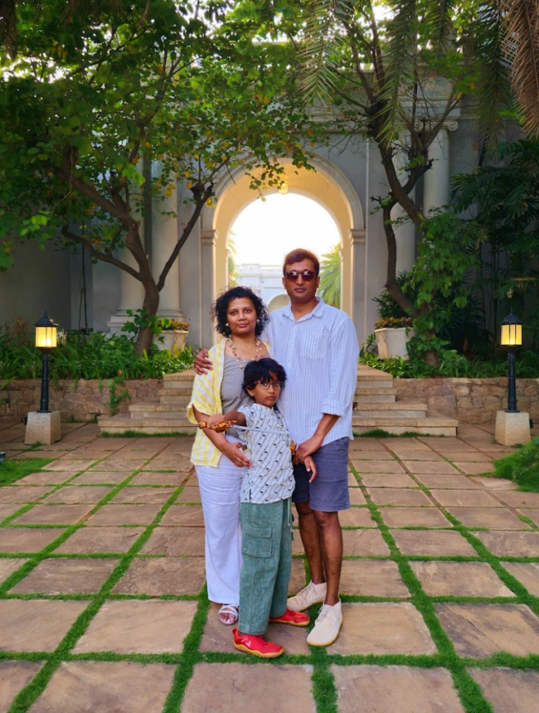 man woman and child family photo in the garden