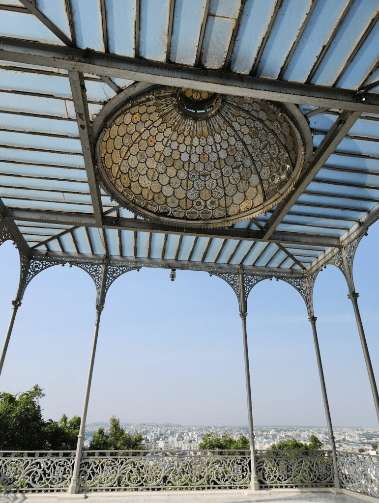 stained glass dome over a balcony overlooking the city of hyderabad