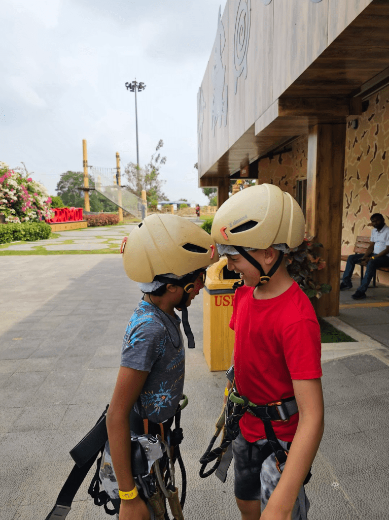 Kids bumping helmets at Ramoji Film City Hyderabad Adventure Park