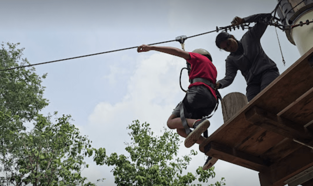 Child zip lining at Ramoji Film City Hyderabad Adventure Park