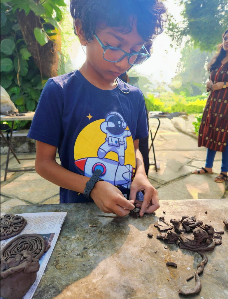 child playing with clay