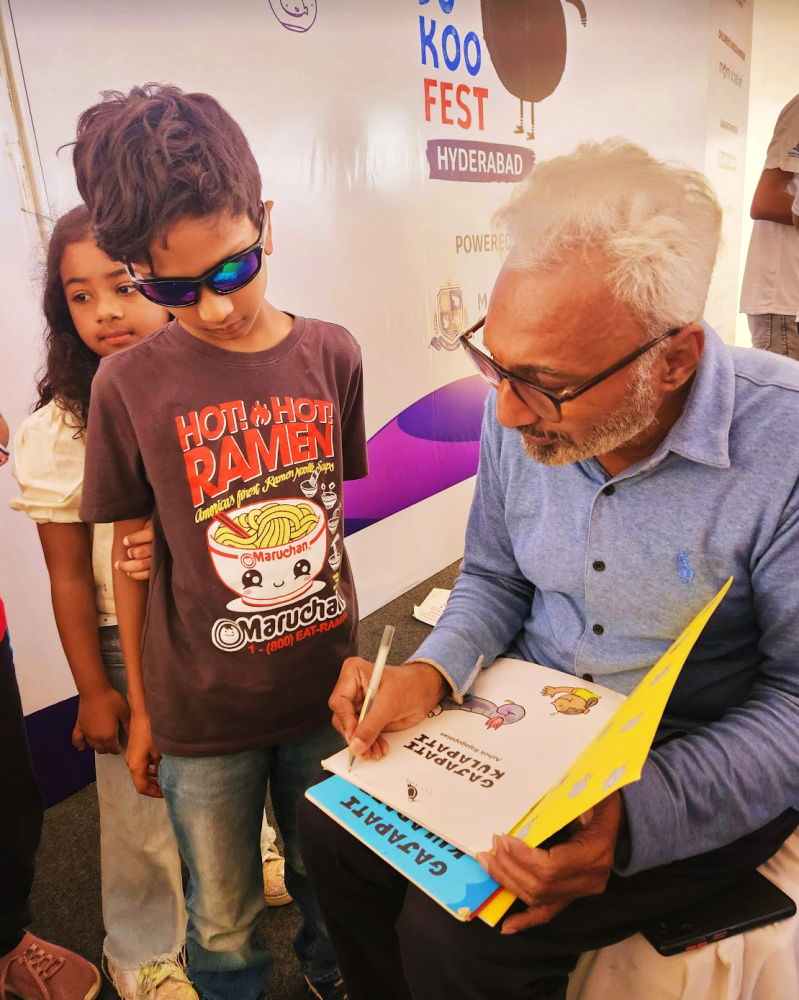 Ashok Rajagopalan signing copies of Gajapati Kulapati