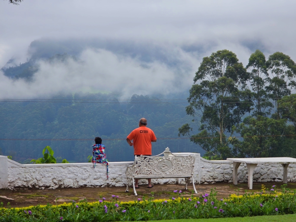 Grandfather and grandson enjoying the Munnar view